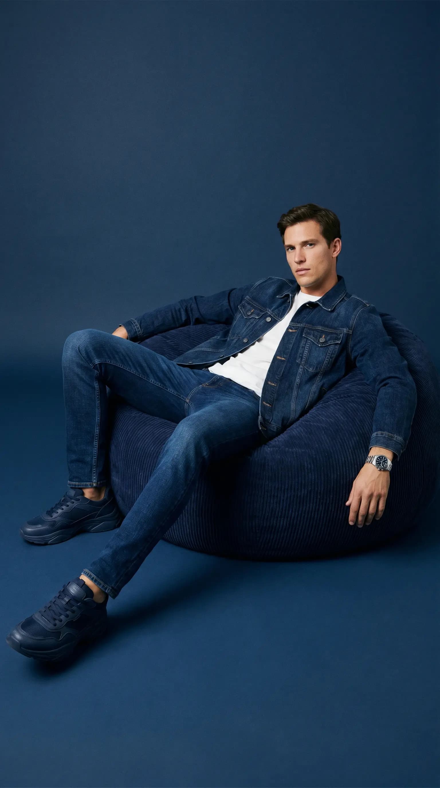 Monochromatic Denim Portrait of a Man on a Navy Bean Bag
